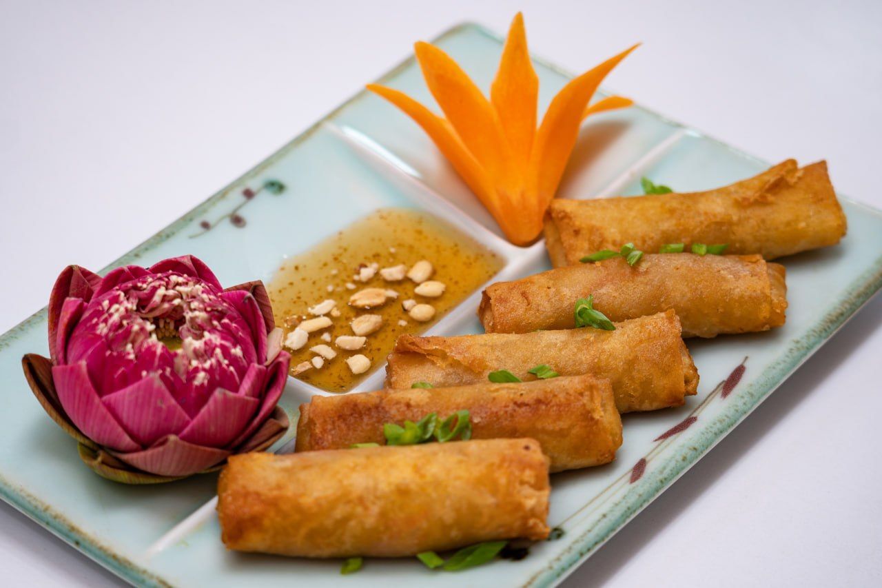 Khmer crispy fried spring rolls with peanut dipping sauce
